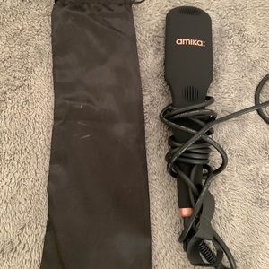Amika Straightening Hairbrush. Only used once. Purchased for $98. Comes with bag